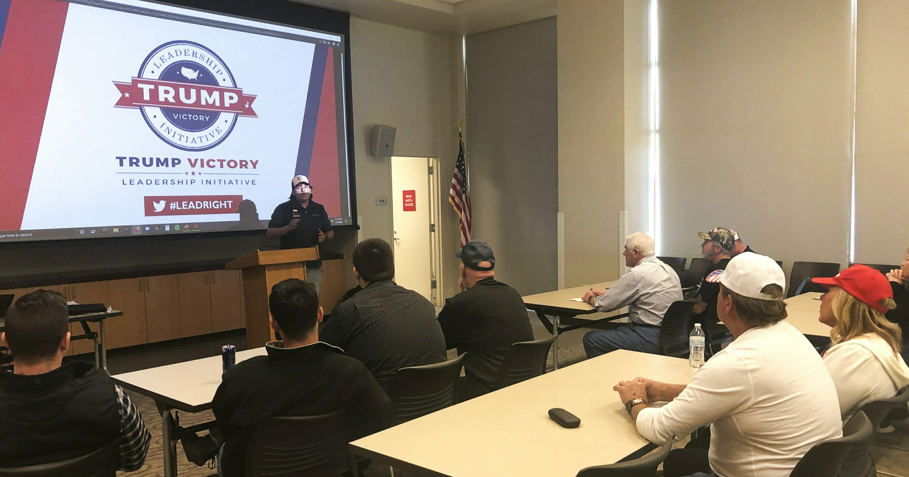 In this Nov. 2, 2019, photo Chris Haskins, a regional field director for President Donald Trump's re-election campaign, leads a "Stop the Madness" training session in Las Vegas. At a suburban Las Vegas library that morning, a small group of Donald Trump supporters filed into an empty meeting room, where they quietly sat at tables watching a slideshow as the president's re-election campaign asked for their help to push back against the House impeachment investigation.