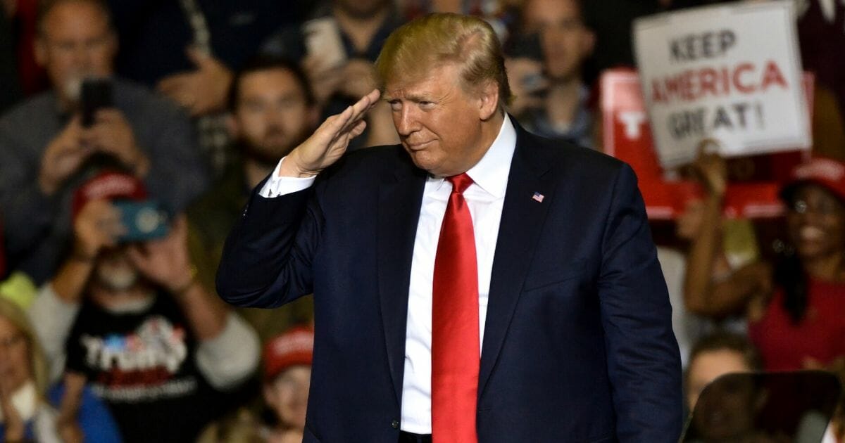 President Donald Trump salutes toward the crowd during a "Keep America Great" campaign rally on Nov. 1, 2019 in Tupelo, Mississippi.