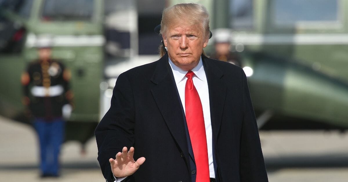 President Donald Trump makes his way to board Air Force One before departing from Andrews Air Force Base in Maryland on Nov. 20, 2019.