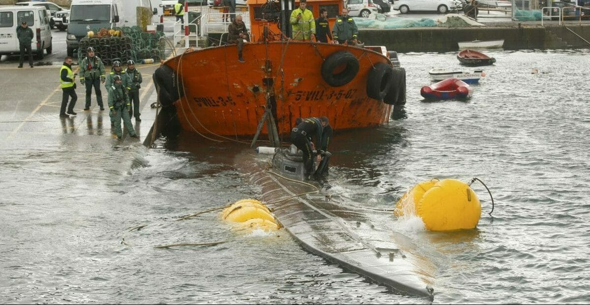 Spanish civil guard tow a sunken submarine