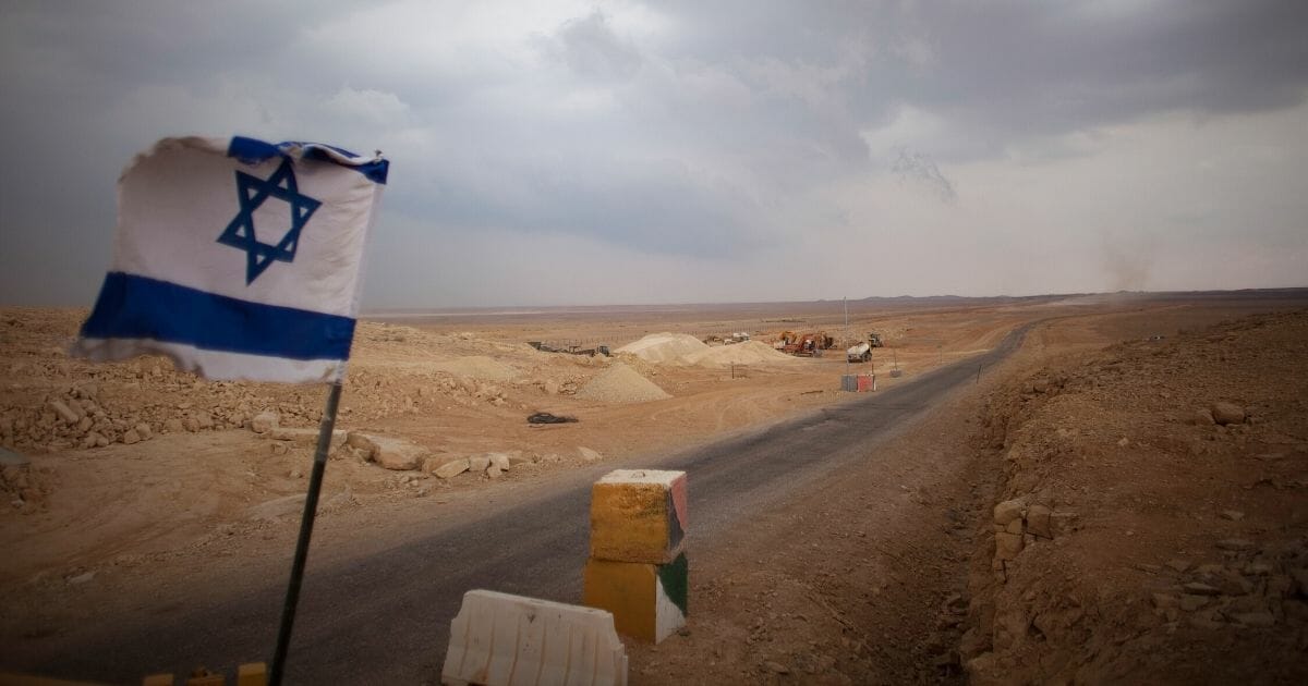 An Israeli flag flies at a checkpoint at the Israeli Egyptian border in Israel.