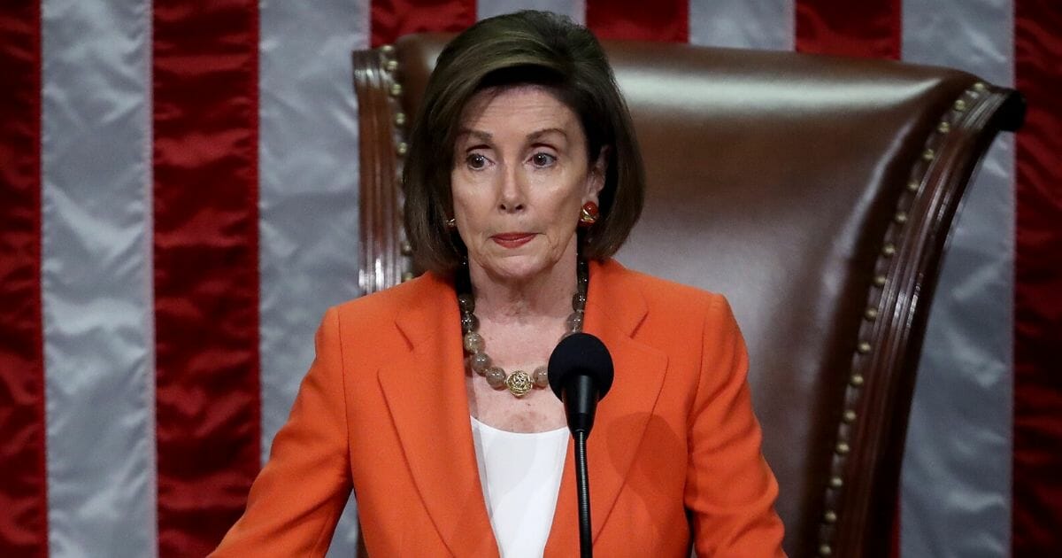 Speaker of the House Nancy Pelosi gavels the close of a vote by the U.S. House of Representatives on a resolution formalizing the impeachment inquiry.