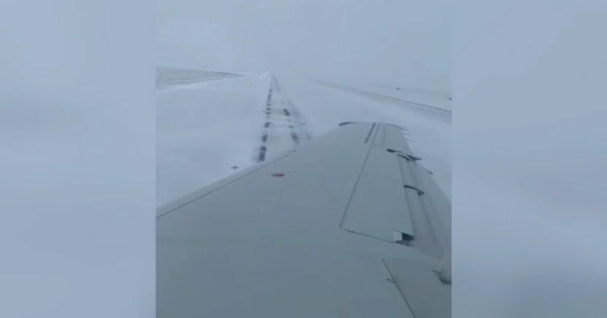 Plane slides off the runway at O'Hare International Airport.