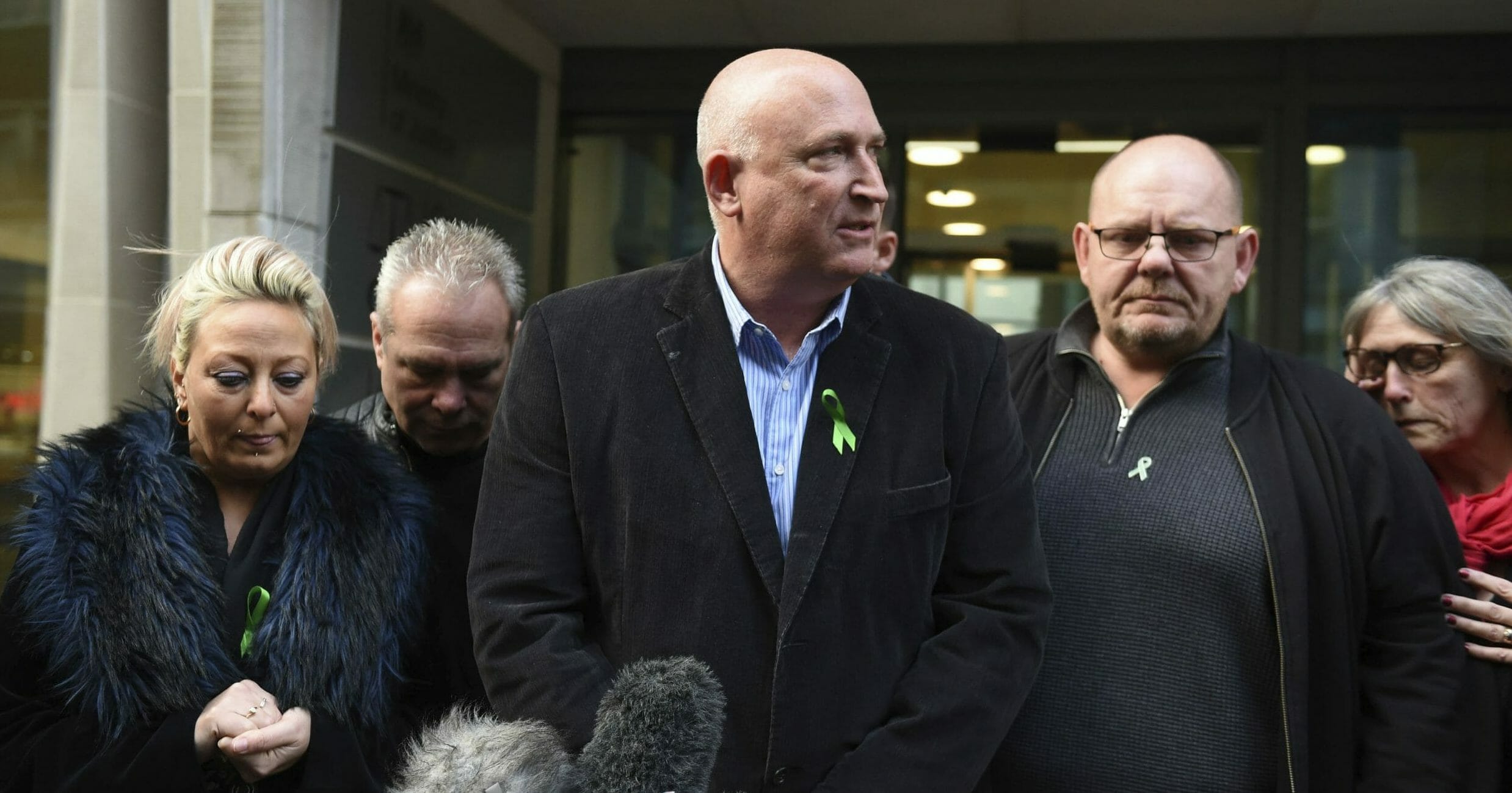 The family of Harry Dunn -- from left, mother Charlotte Charles, stepfather Bruce Charles, family spokesman Radd Seiger, father Tim Dunn and stepmother Tracey Dunn -- speak to the media outside the Ministry of Justice in London on Dec. 20, 2019.