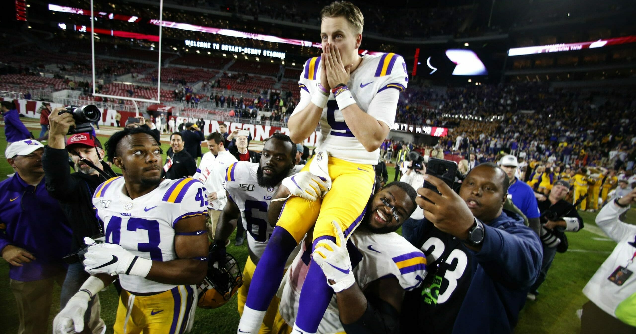 LSU quarterback Joe Burrow (9) is carried off the field by his teammates after defeating Alabama 46-41 in an NCAA college football game on Nov. 9, 2019, in Tuscaloosa , Alabama.