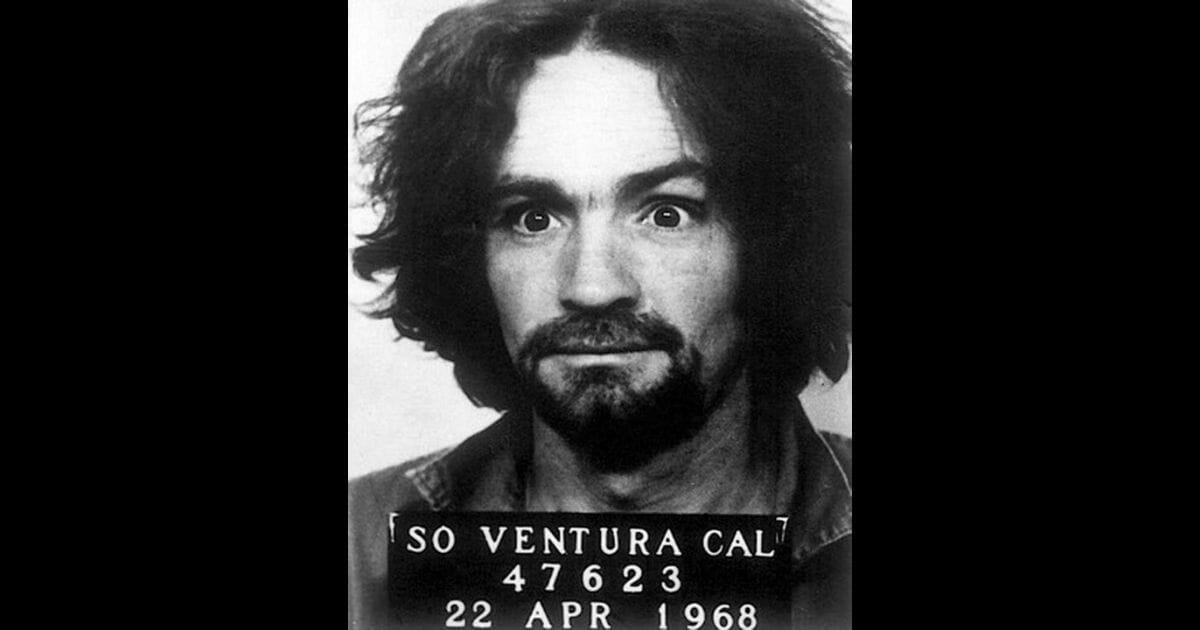A mugshot of Charles Manson is seen.