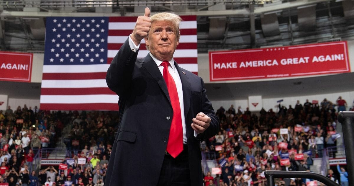 President Donald Trump gives a thumbs up during a Make America Great Again rally in Green Bay, Wisconsin, on April 27, 2019.