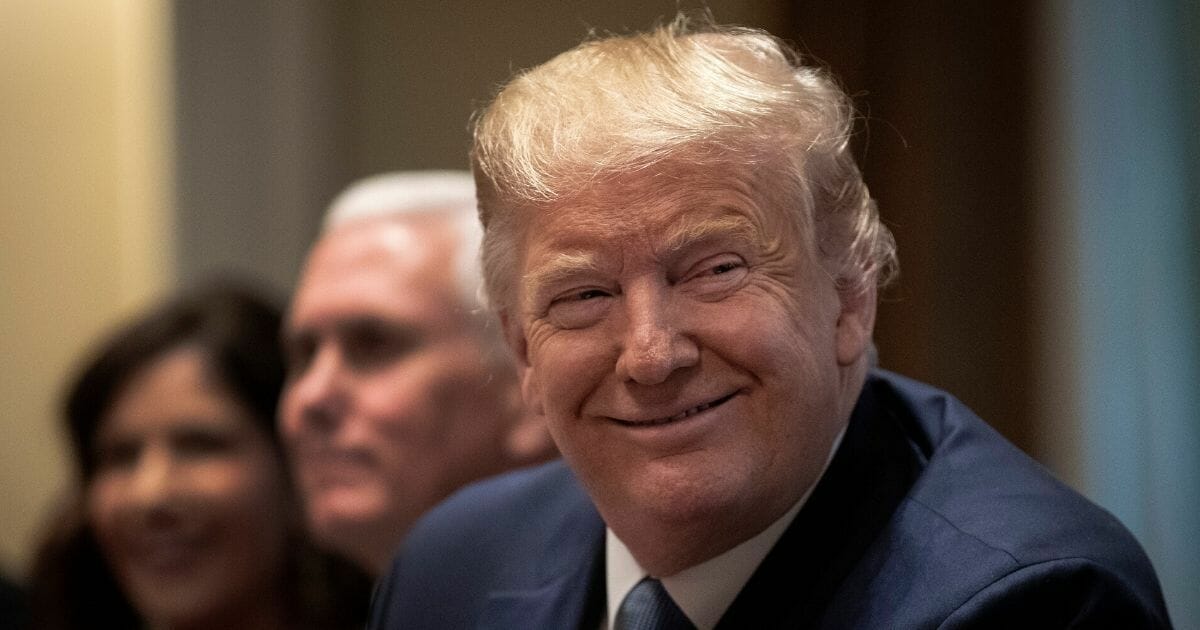President Donald Trump listens during a meeting in the Cabinet Room of the White House on Dec. 16, 2019.