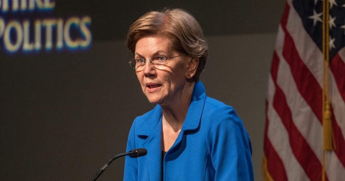 Democratic presidential candidate Sen. Elizabeth Warren gestures as she delivers an economic policy speech on Dec. 12, 2019, in Manchester, New Hampshire.