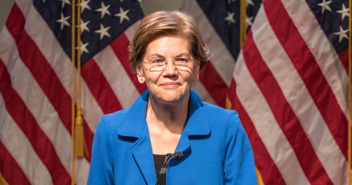 Democratic presidential candidate Sen. Elizabeth Warren gestures as she delivers an economic policy speech on Dec. 12, 2019, in Manchester, New Hampshire.