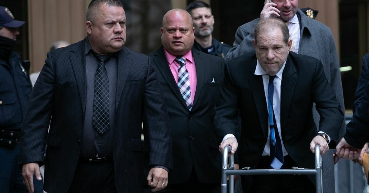 Movie producer Harvey Weinstein uses a walker as he leaves criminal court after a bail hearing Dec. 11, 2019, in New York.
