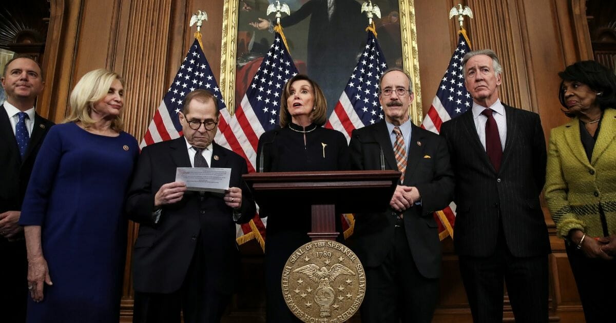 House Speaker Nancy Pelosi of California speaks during a news conference alongside other Democrats at the U.S. Capitol on Dec. 18, 2019, after the House voted to impeach President Donald Trump.