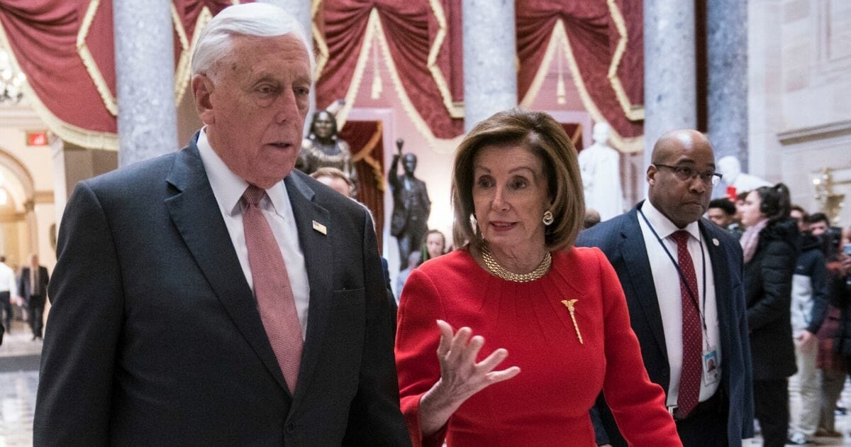 House Majority Leader Steny Hoyer, D-Md., and House Speaker Nancy Pelosi, D-Calif., walk away from the House floor in the U.S. Capitol on Dec. 19, 2019.