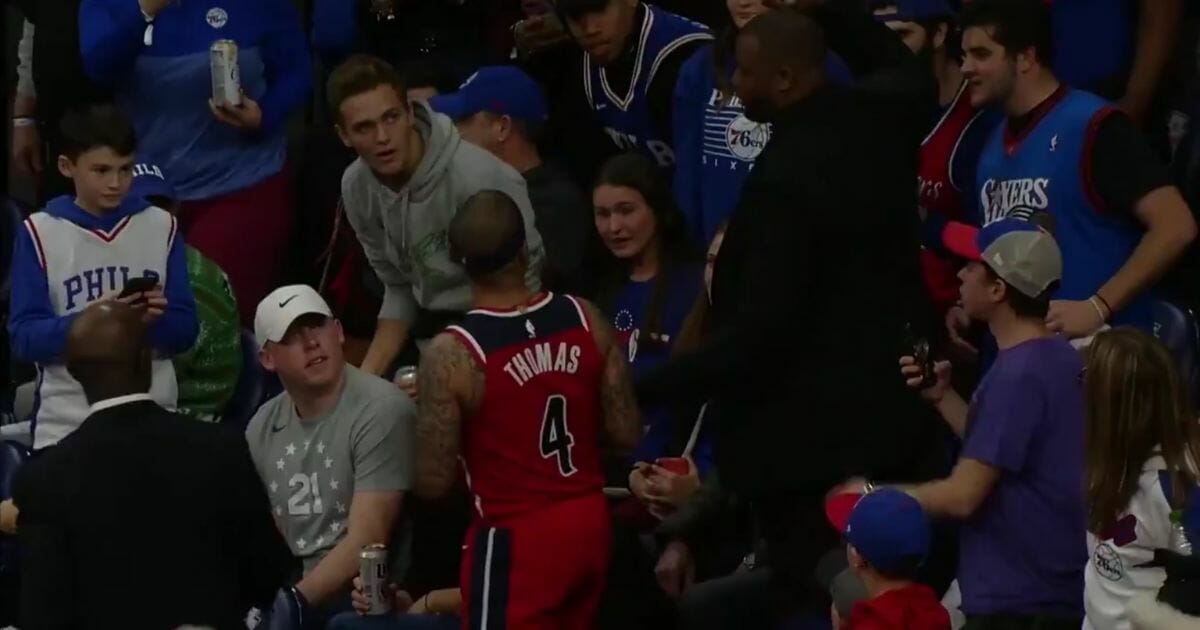 Isaiah Thomas goes into the stands