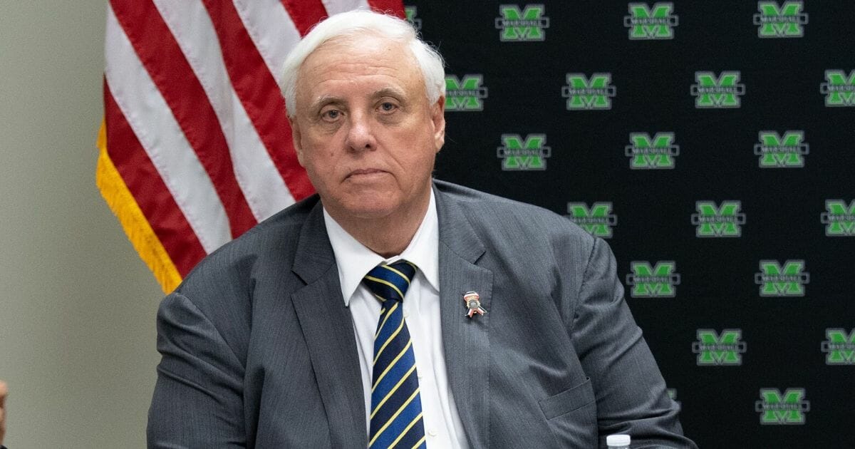 West Virginia Gov. Jim Justice attends a roundtable discussion on the opioid epidemic with local and state officials at the Cabell-Huntington Health Department in Huntington, West Virginia, on July 8, 2019.