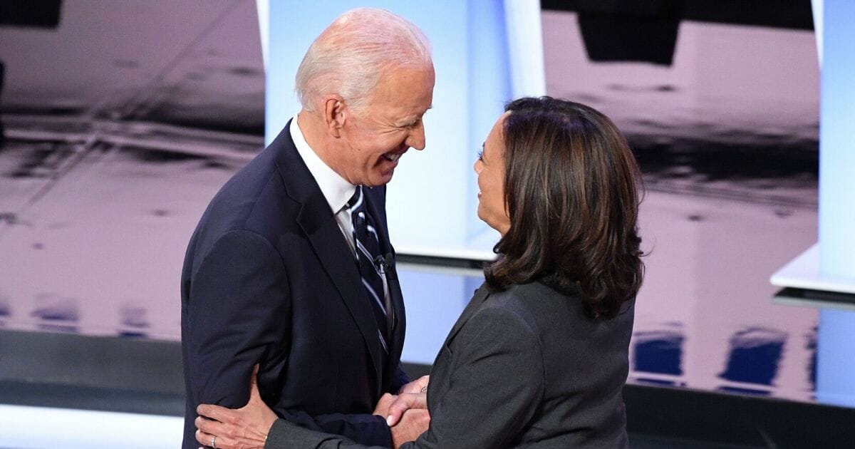 Democratic presidential hopefuls former Vice President Joe Biden, left, and Sen. Kamala Harris greet each other ahead of the second round of the second Democratic primary debate of the 2020 presidential campaign season in Detroit on July 31, 2019.