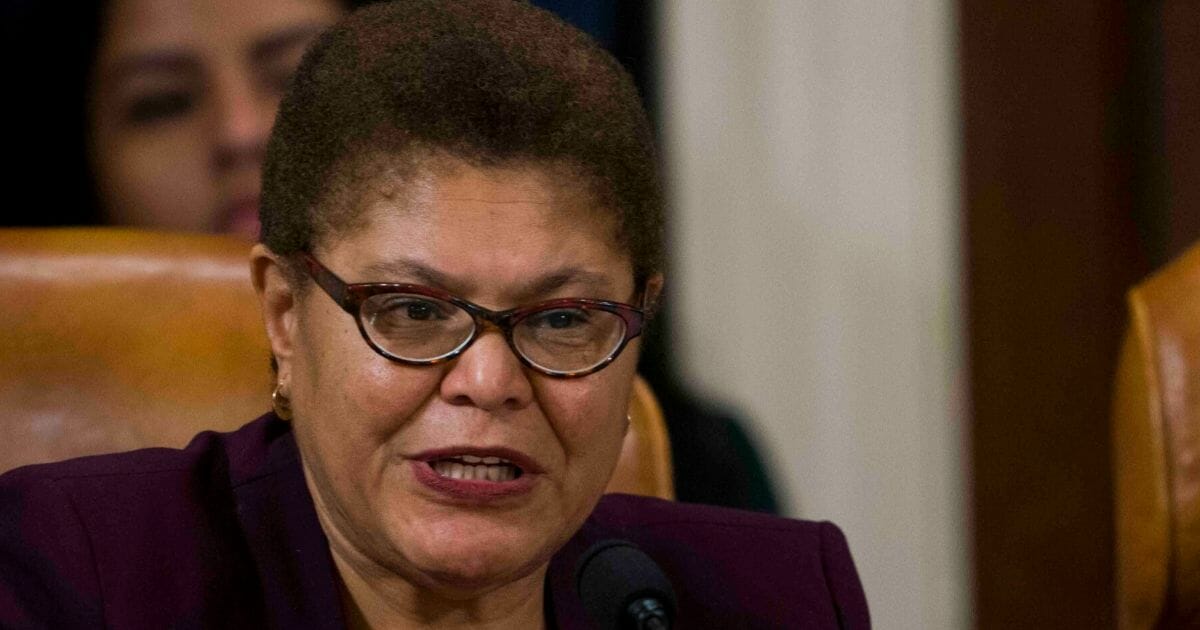 Rep. Karen Bass (D-Calif.) questions Intelligence Committee Minority Counsel Stephen Castor and Intelligence Committee Majority Counsel Daniel Goldman during the House impeachment inquiry hearings in the Longworth House Office Building on Capitol Hill Dec. 9, 2019, in Washington, D.C.