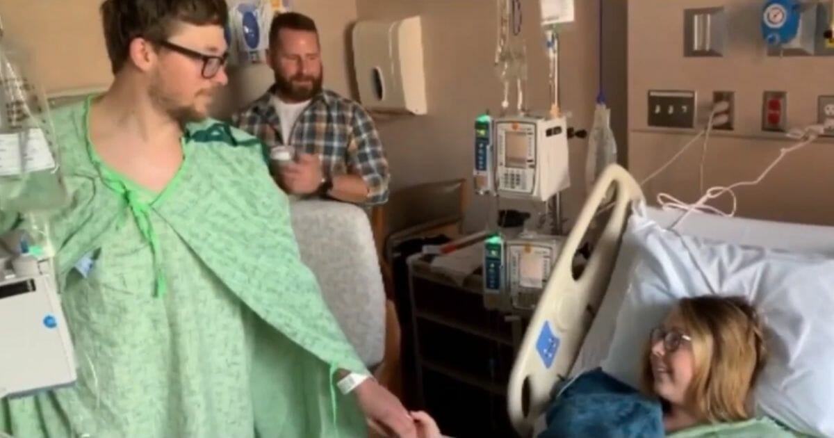 Logan and Vanessa Bosselaar hold hands in the hospital.