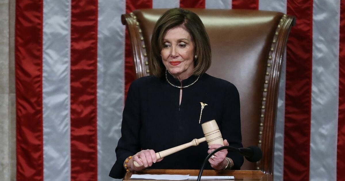 Speaker of the House Nancy Pelosi (D-California) presides over the House of Representatives as they vote on the second article of impeachment of President Donald Trump in the House Chamber at the U.S. Capitol on Dec. 18, 2019, in Washington, D.C.