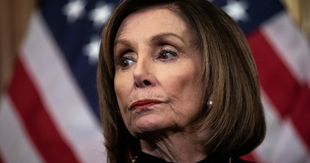 Speaker of the House Nancy Pelosi (D-California) looks on during a news conference after the House of Representatives voted to impeach President Donald Trump at the U.S. Capitol on Dec. 18, 2019, in Washington, D.C.