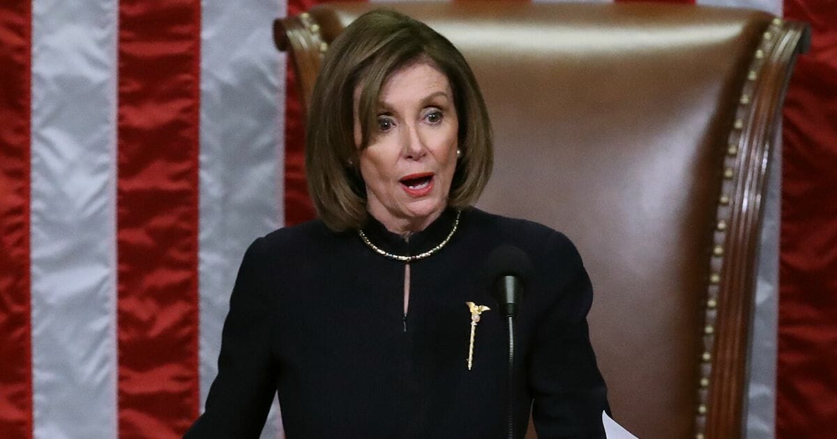 Speaker of the House Nancy Pelosi (D-Calif.) presides over the House of Representatives as they vote on the second article of impeachment of U.S. President Donald Trump at in the House Chamber at the U.S. Capitol on Dec. 18, 2019, in Washington, D.C.