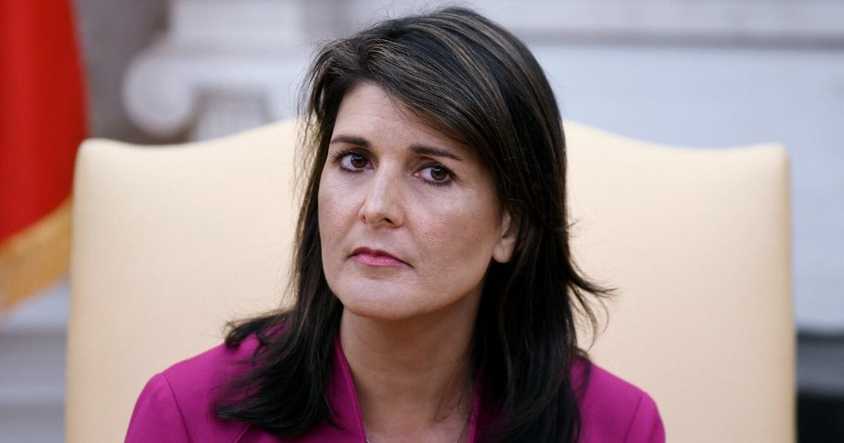 Nikki Haley, the United States Ambassador to the United Nations looks on during a meeting with US President Donald Trump speaks in the Oval office of the White House Oct. 9, 2018, in Washington, D.C.