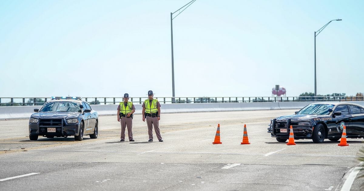 Florida State Troopers block traffic over the Bayou Grande Bridge leading to the Pensacola Naval Air Station following a shooting on Dec. 6, 2019, in Pensacola, Florida.