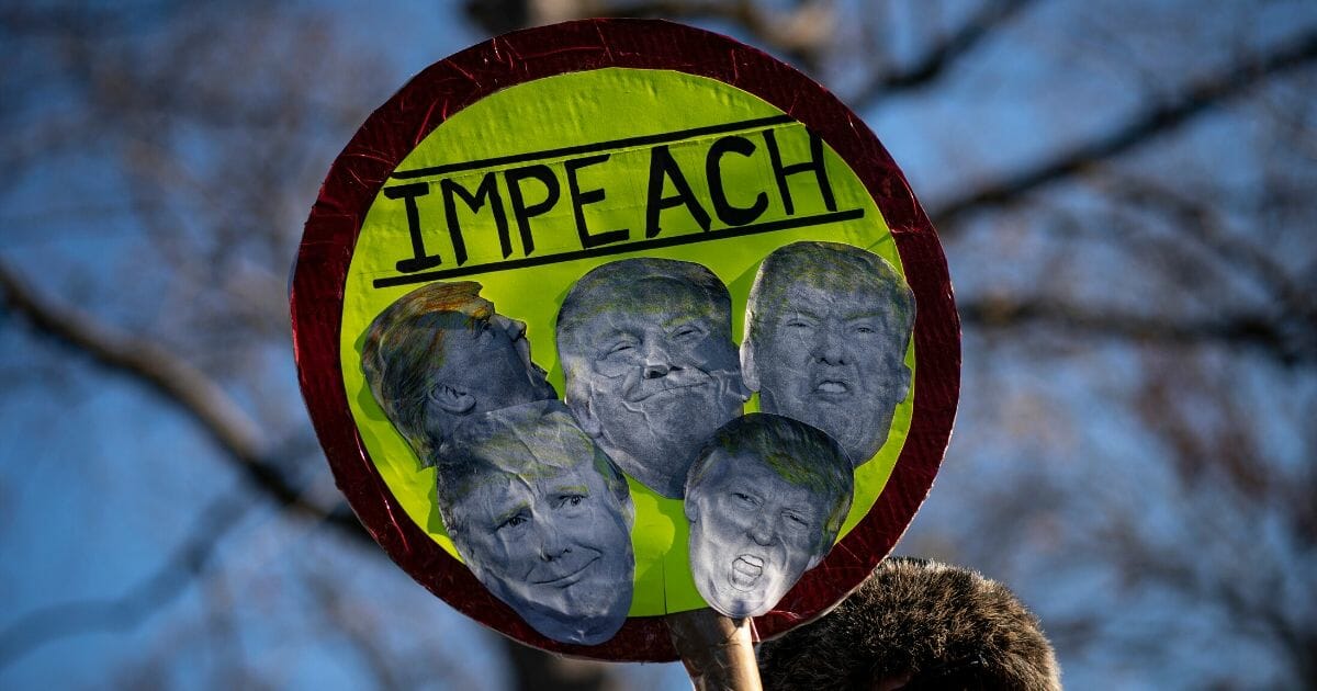 Protesters supporting the impeachment of President Donald Trump gather outside the U.S. Capitol on Dec. 18, 2019, in Washington, D.C.
