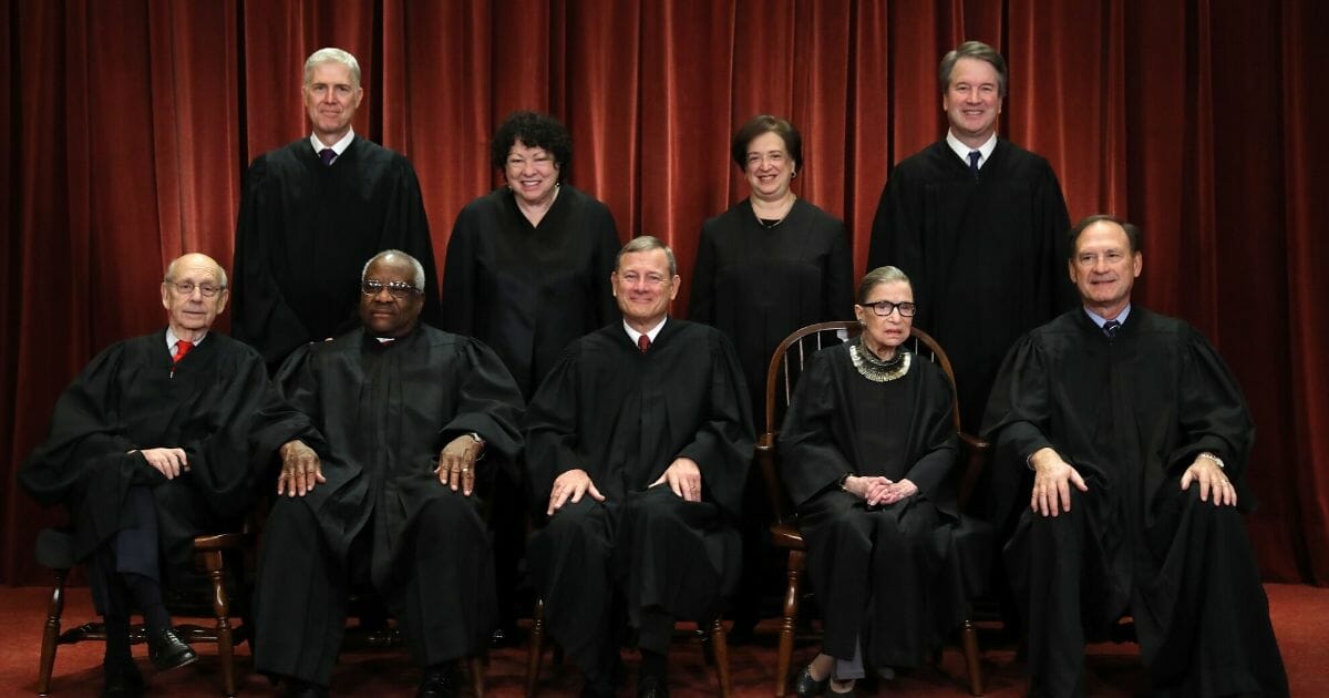 United States Supreme Court (Front Left-Right) Associate Justice Stephen Breyer, Associate Justice Clarence Thomas, Chief Justice John Roberts, Associate Justice Ruth Bader Ginsburg, Associate Justice Samuel Alito, Jr., (Back Left-Right) Associate Justice Neil Gorsuch, Associate Justice Sonia Sotomayor, Associate Justice Elena Kagan and Associate Justice Brett Kavanaugh pose for their official portrait at the in the East Conference Room at the Supreme Court building Nov. 30, 2018, in Washington, D.C.