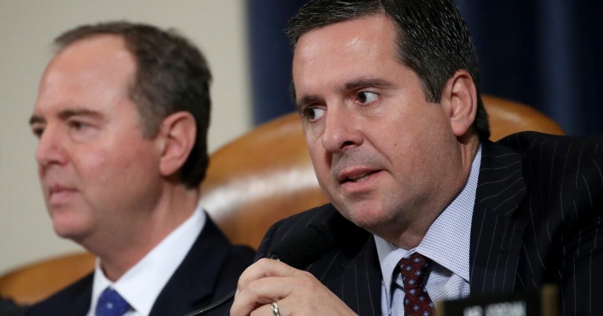 Republican Rep. Devin Nunes of California, right, the ranking member of the House Intelligence Committee, speaks during an impeachment hearing as committee chairman Adam Schiff, D-Calif., looks on Nov. 20, 2019, in the Longworth House Office Building in Washington.