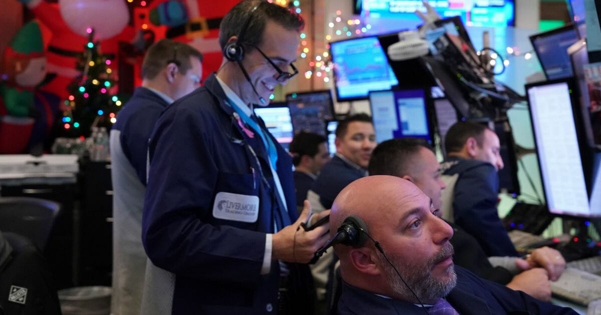 Traders work on the floor at the closing bell of the Dow Industrial Average at the New York Stock Exchange on Dec. 5, 2019, in New York.