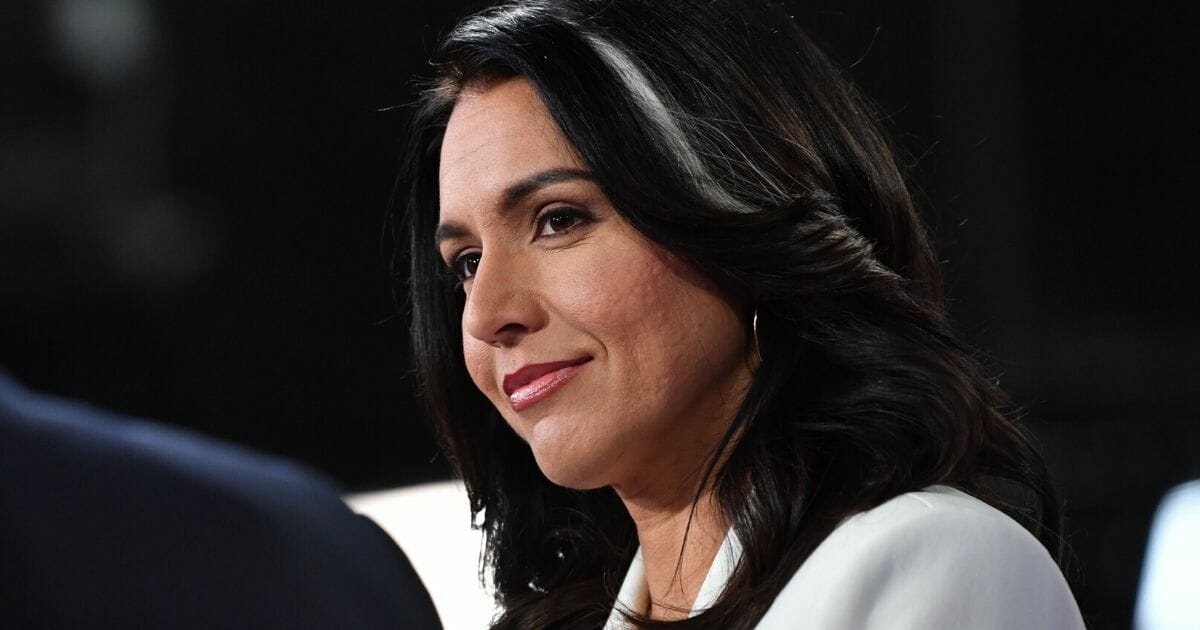 Democratic presidential candidate and Rep. Tulsi Gabbard of Hawaii talks to reporters following the fifth Democratic primary debate of the 2020 presidential campaign season Nov. 20, 2019, at Tyler Perry Studios in Atlanta.