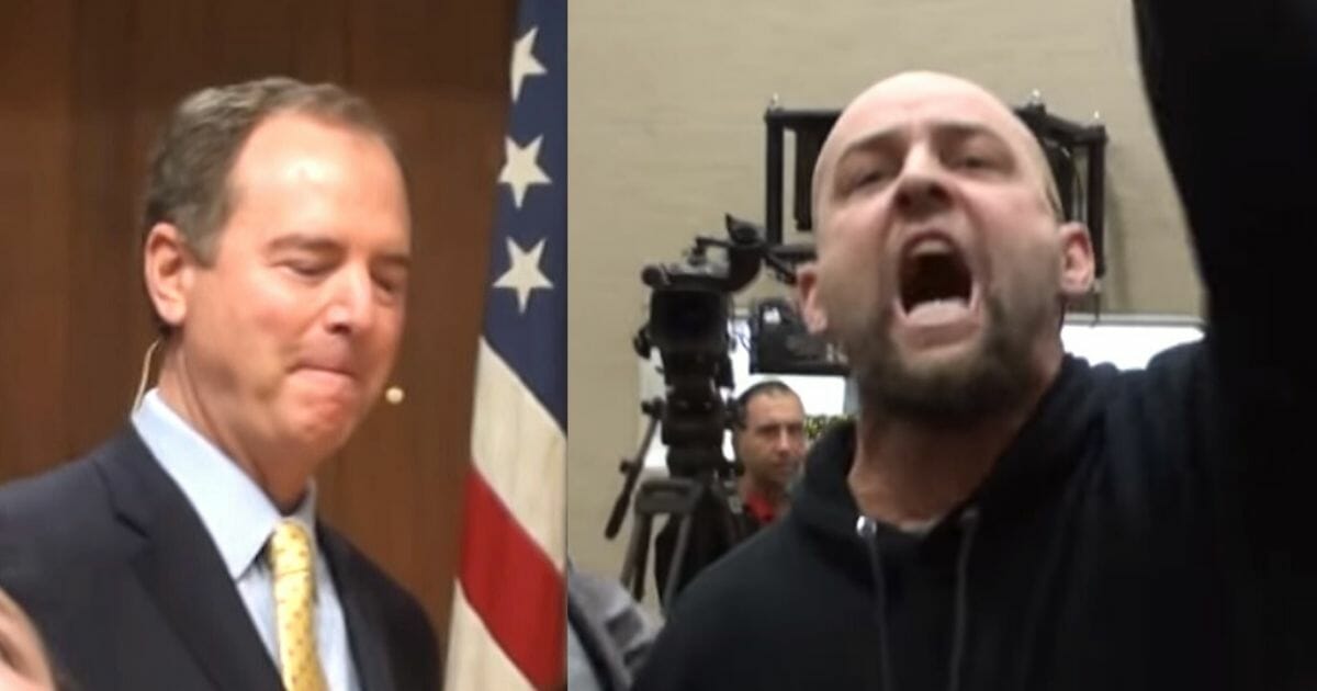 Adam Schiff is confronted by protesters during a town hall.