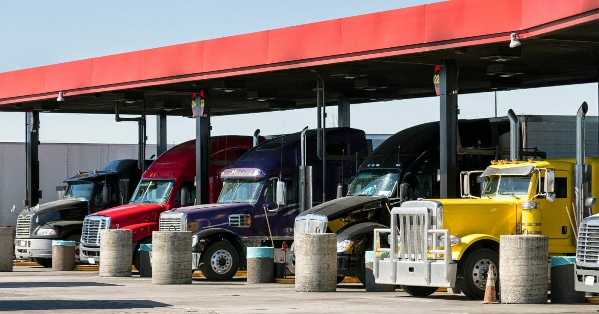 Stock image of trucks fueling up.