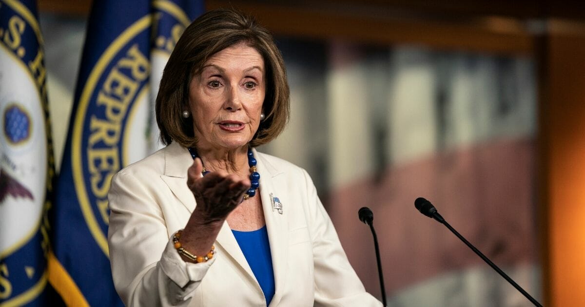 House Speaker Nancy Pelosi gestures during a Nov. 21 news conference in Washington.