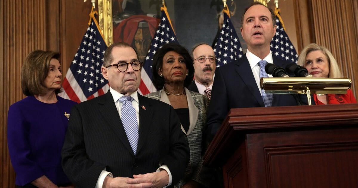 House Intelligence Committee Chairman Rep. Adam Schiff speaks Tuesday in the Capitol as Democrats announced articles of impeachment against President Donald Trump. With him are House Speaker Nancy Pelosi,  House Judiciary Committee Rep. Jerry Nadler, Rep. Maxine Waters, Rep. Eliot Engel and Rep. Carolyn Maloney.