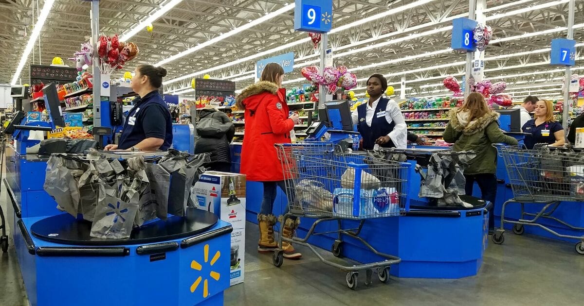 Customers check out at a Walmart in Saugus, Massachusetts.