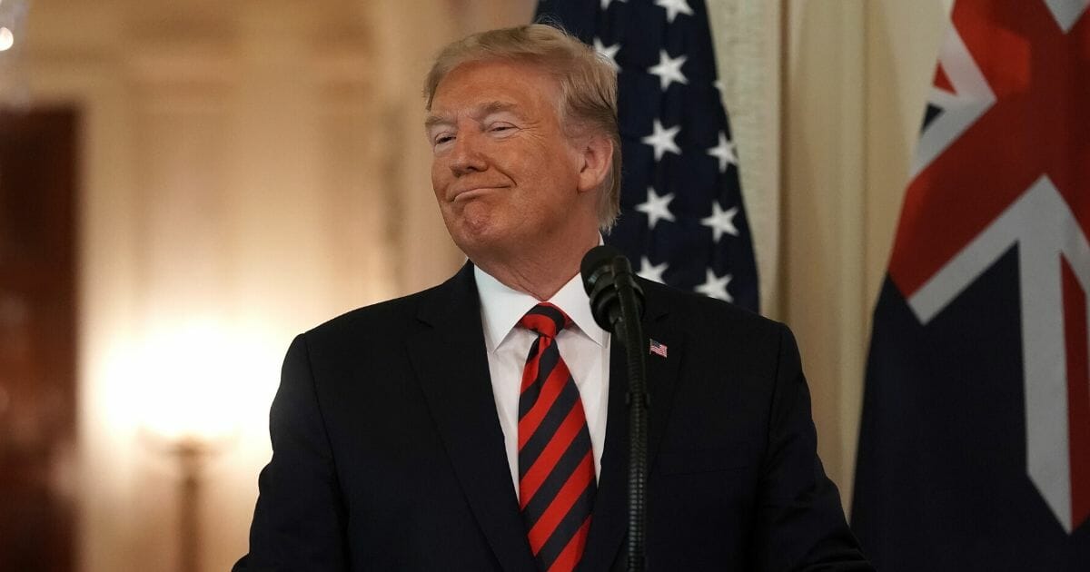 President Donald Trump grins during a White House appearance with Australian Prime Minister Scott Morrison in the White House in September.