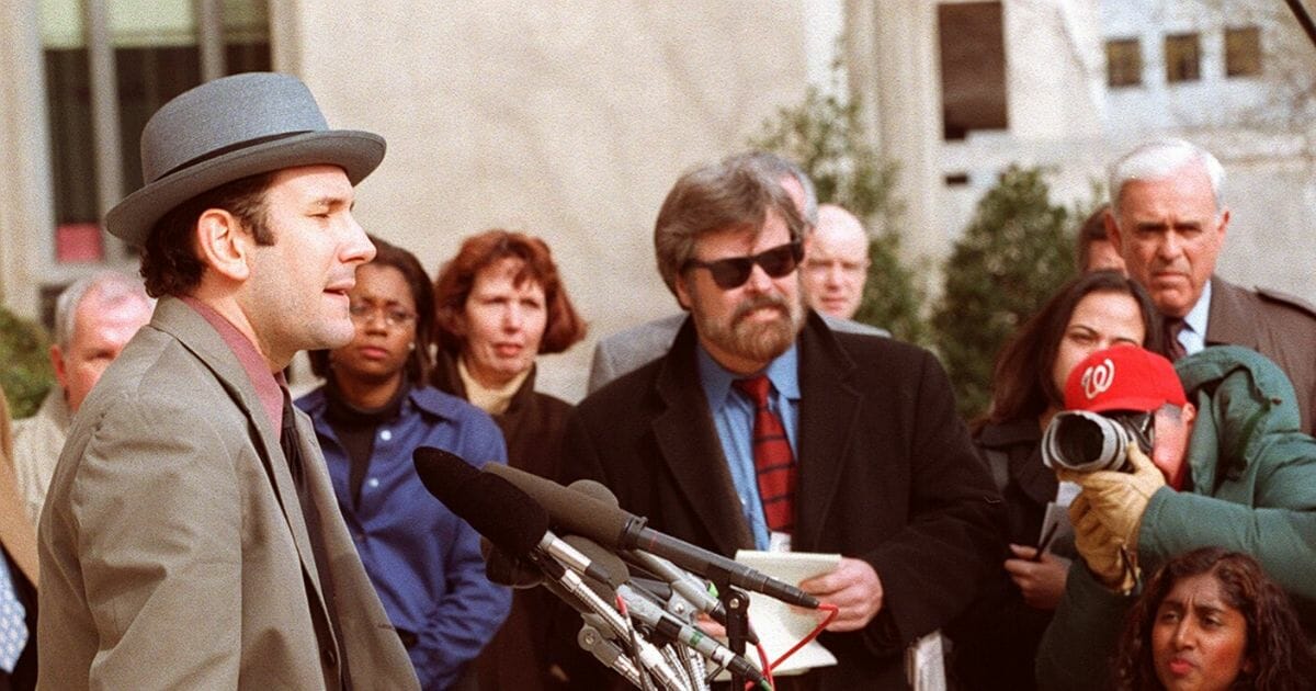 Drudge Report founder Matt Drudge speaks to reporters outside the U.S. District Courthouse in Washington, D.C., on March 11, 1998.