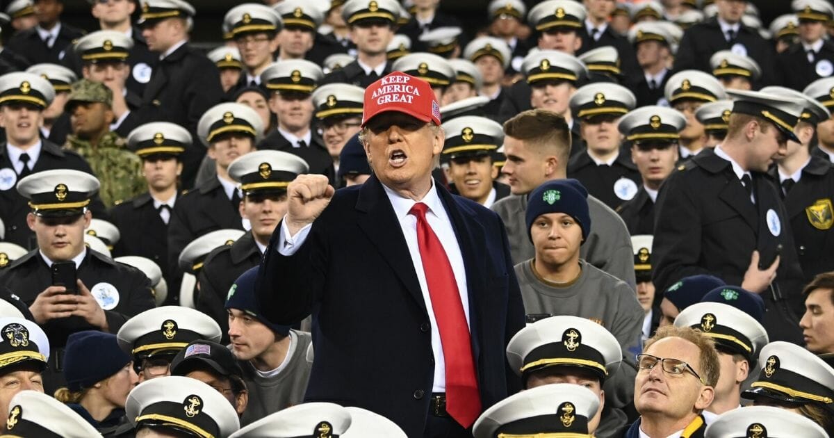 President Donald Trump joins Naval Academy cadets during the the Army v. Navy football game in Philadelphia on Dec. 14, 2019.