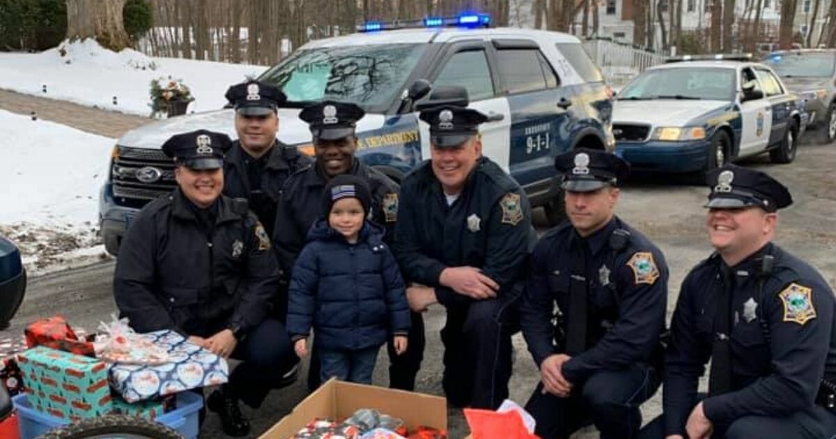 A Massachusetts boy named JJ is surprised by local police officers giving him a special Christmas celebration.