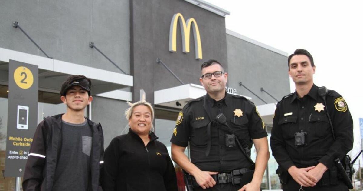 McDonald's employees pose for a photo with deputies from the San Joaquin County Sheriff's Office.