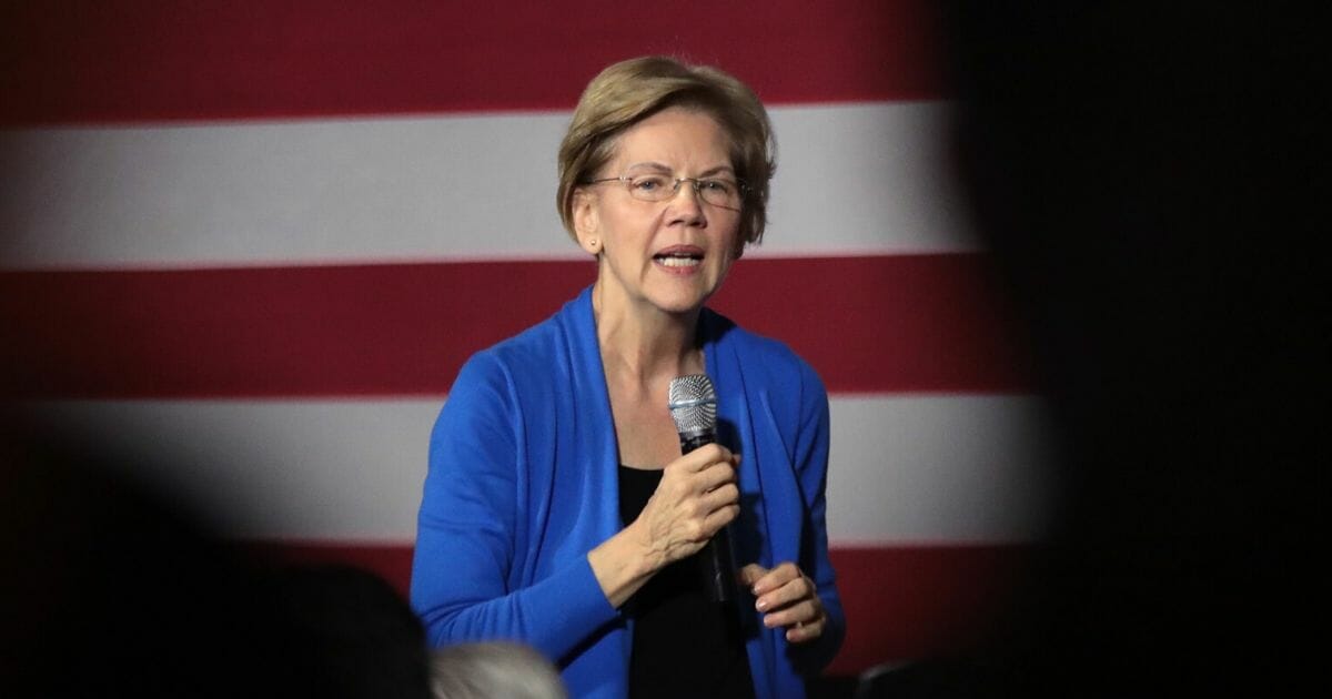 Democratic presidential candidate Sen. Elizabeth Warren of Massachusetts speaks to guests during a campaign stop at the CSPS cultural center on Dec. 21, 2019 in Cedar Rapids, Iowa.