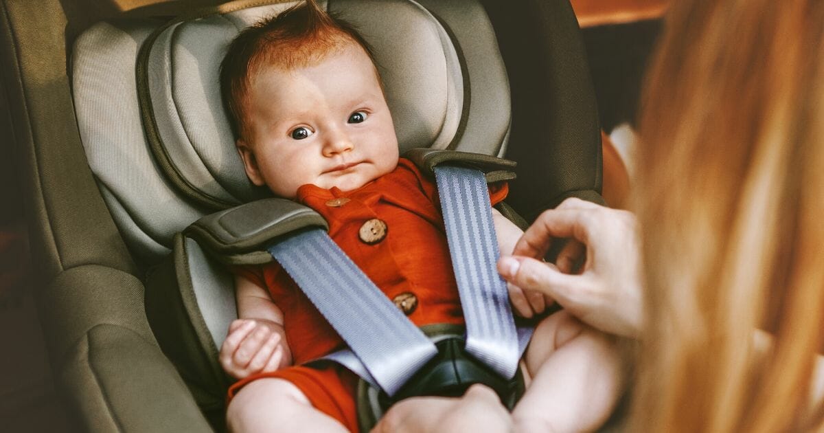 Stock image of a baby in a car seat.
