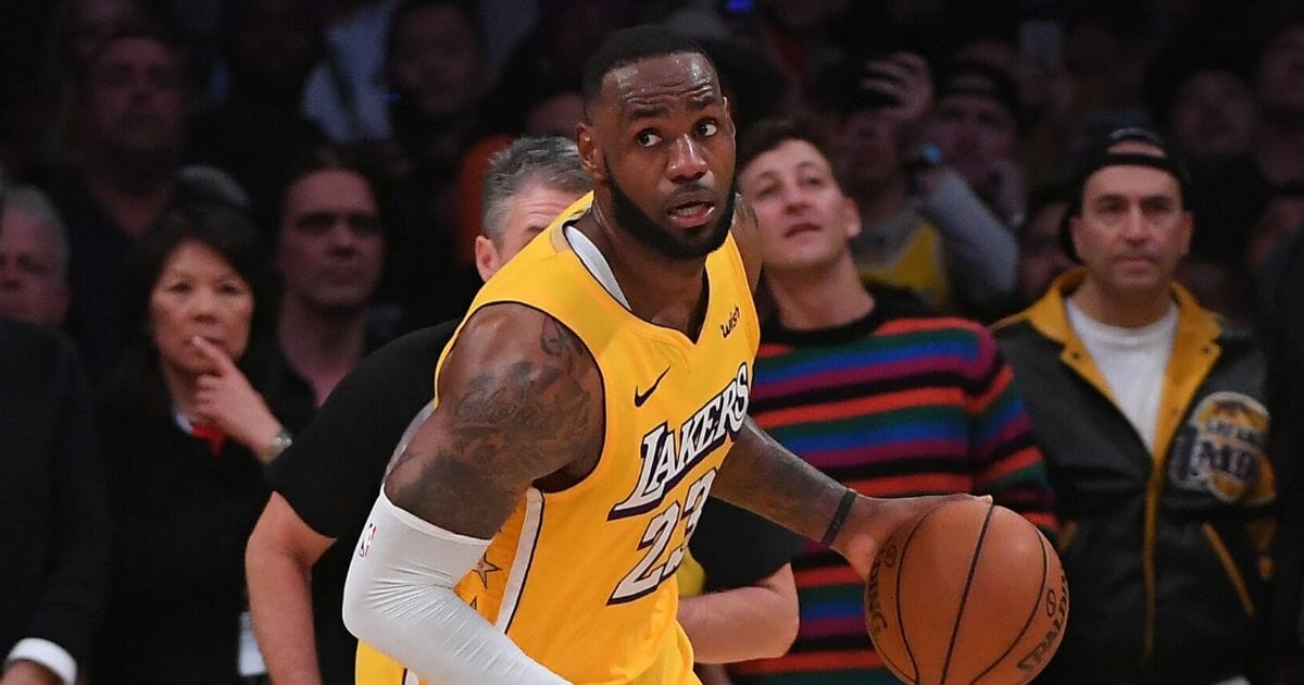 Los Angeles Lakers star LeBron James takes the ball down court in a Christmas Day game against the Los Angeles Clippers at the Staples Center.