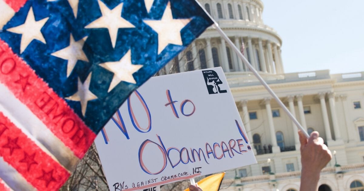 Supporters of the tea party movement demonstrate against the Obamacare health care bill outside the U.S. Capitol in Washington, D.C., on March 20, 2010.