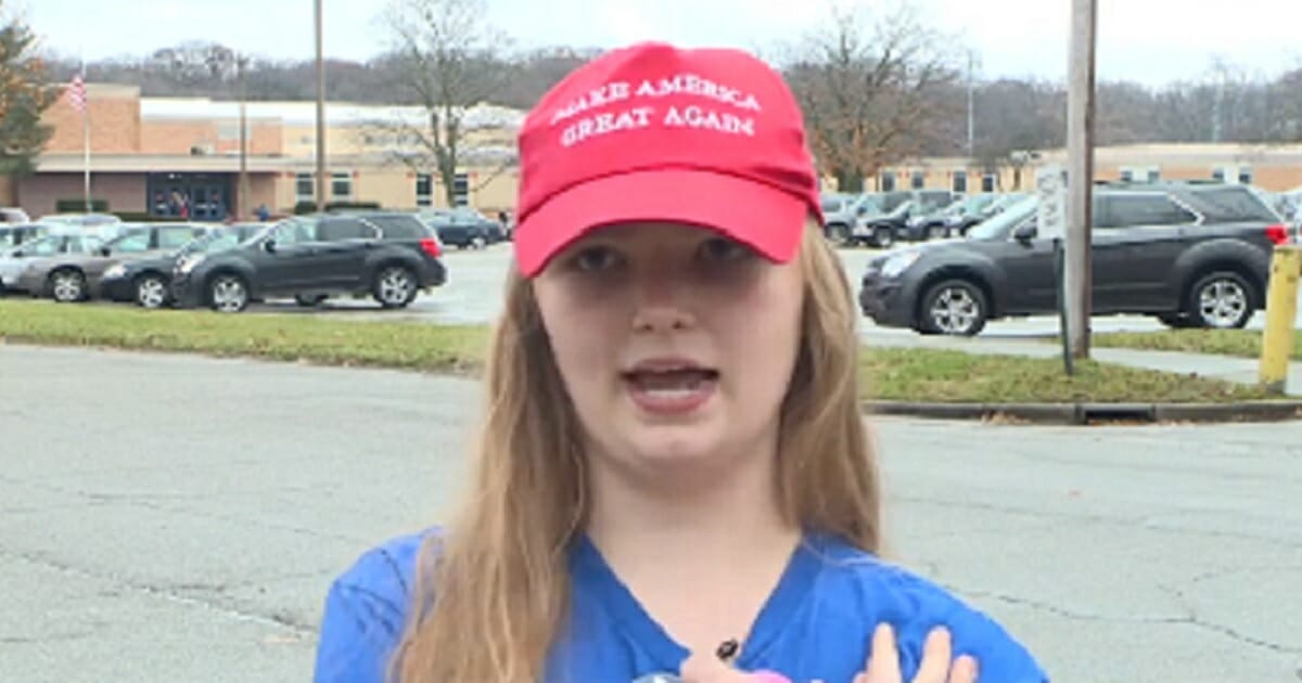 Sadie Earegood, a student at Mason High School in Mason, Wisconsin, is interviewed wearing a "Make America Great Again" cap.
