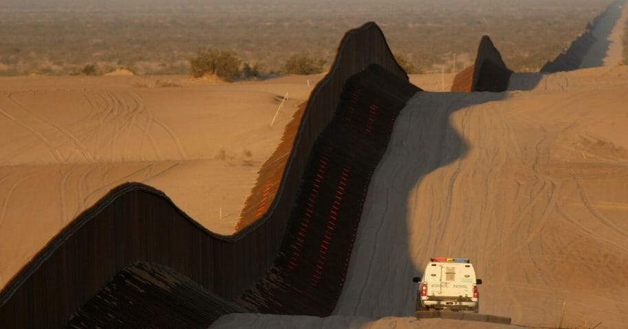 A border patrol vehicle drags the sand to make any new footprints of border crossers more visible along a recently constructed section of the controversial U.S.-Mexico border fence expansion on previously pristine desert sands on March 14, 2009, between Yuma, Arizona, and Calexico, California.