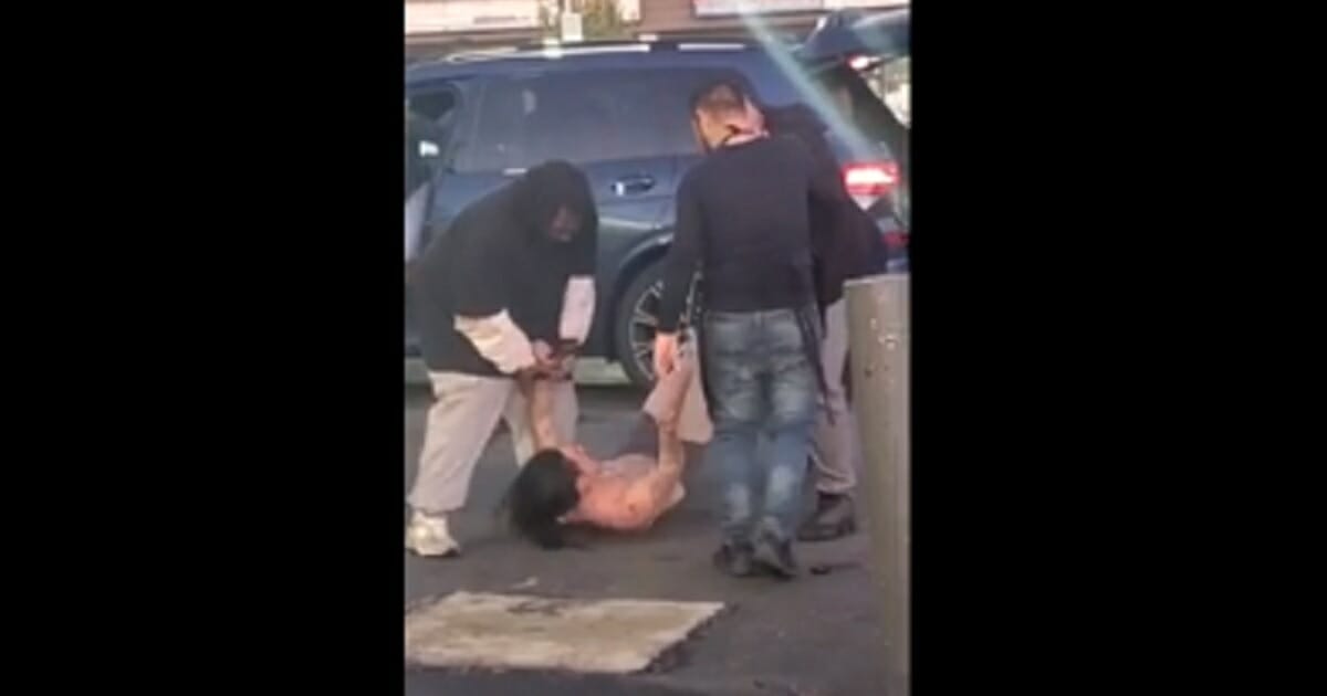 A suspected carjacker is pinned to the ground in Stockon, California.