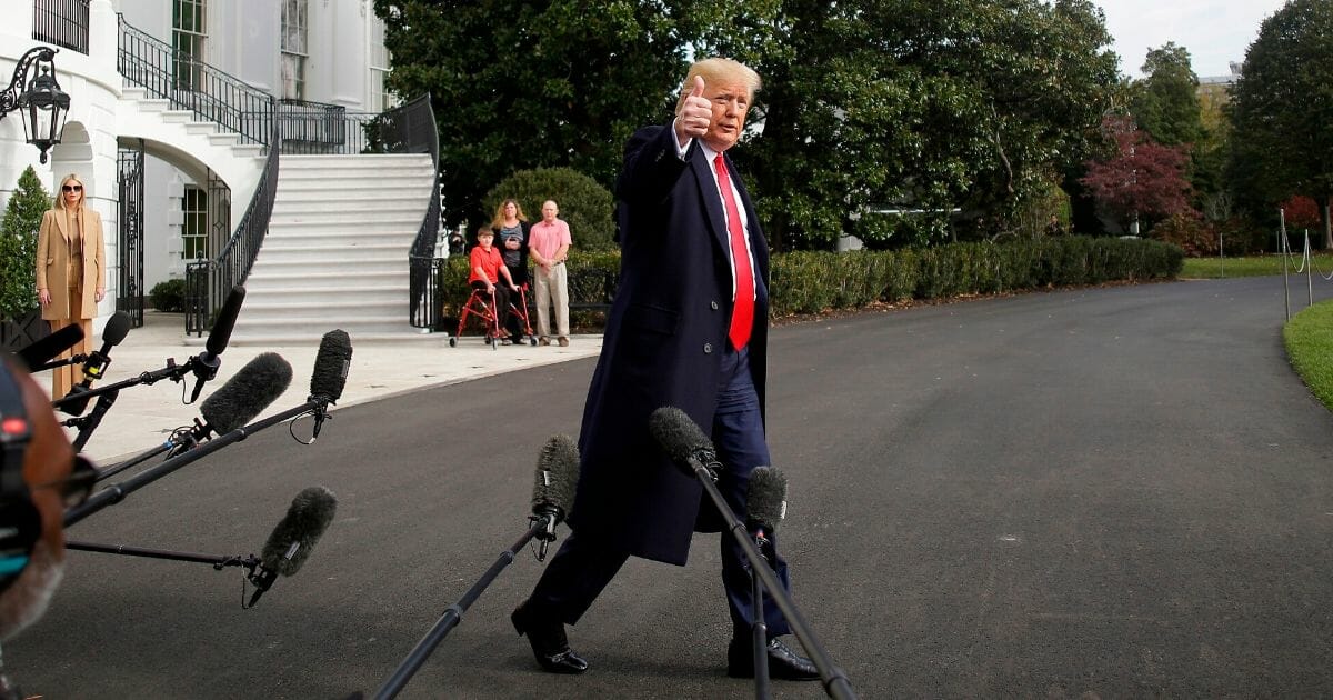 President Donald Trump talks to the media on the South Lawn of the White House before boarding Marine One in Washington, D.C.